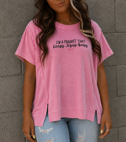 I’m a Project That Keeps Jesus Busy Pink Embroidered Top Zenana Hi Low Acid Wash Shirt
